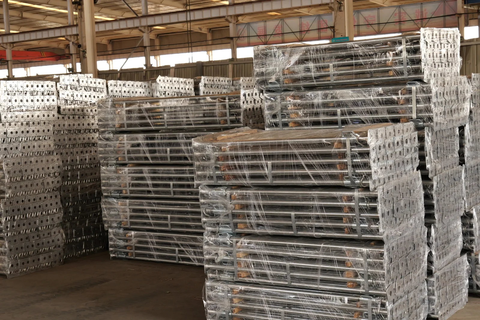 Packaged finished construction-support components in factory inventory