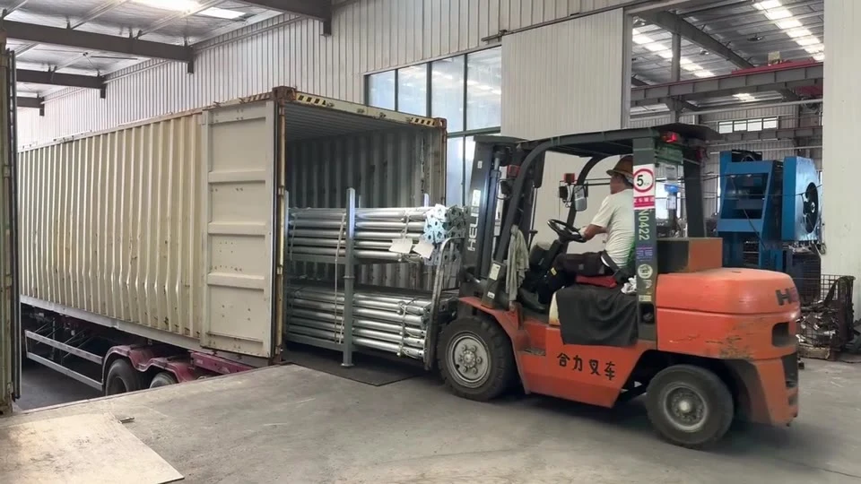 Racked steel props being loaded into a shipping container