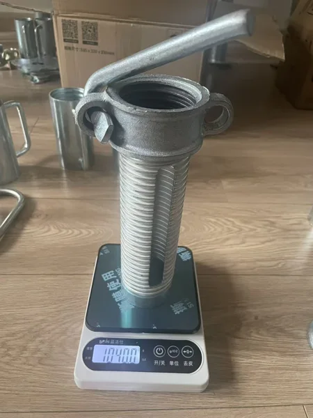 Slotted sleeve and handled nut assembly on a scale