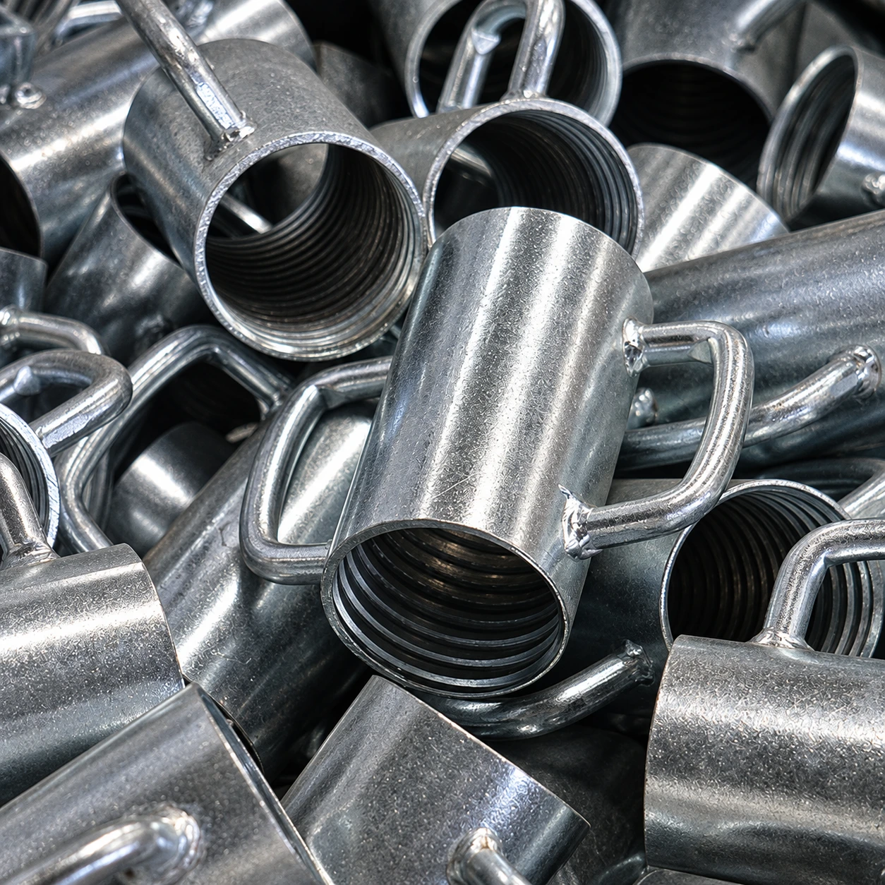 Cup-type adjustment nuts — enhanced photograph