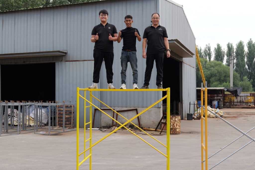 Confidently standing on our heavy duty scaffolding, demonstrating superior structure quality and high load capacity.